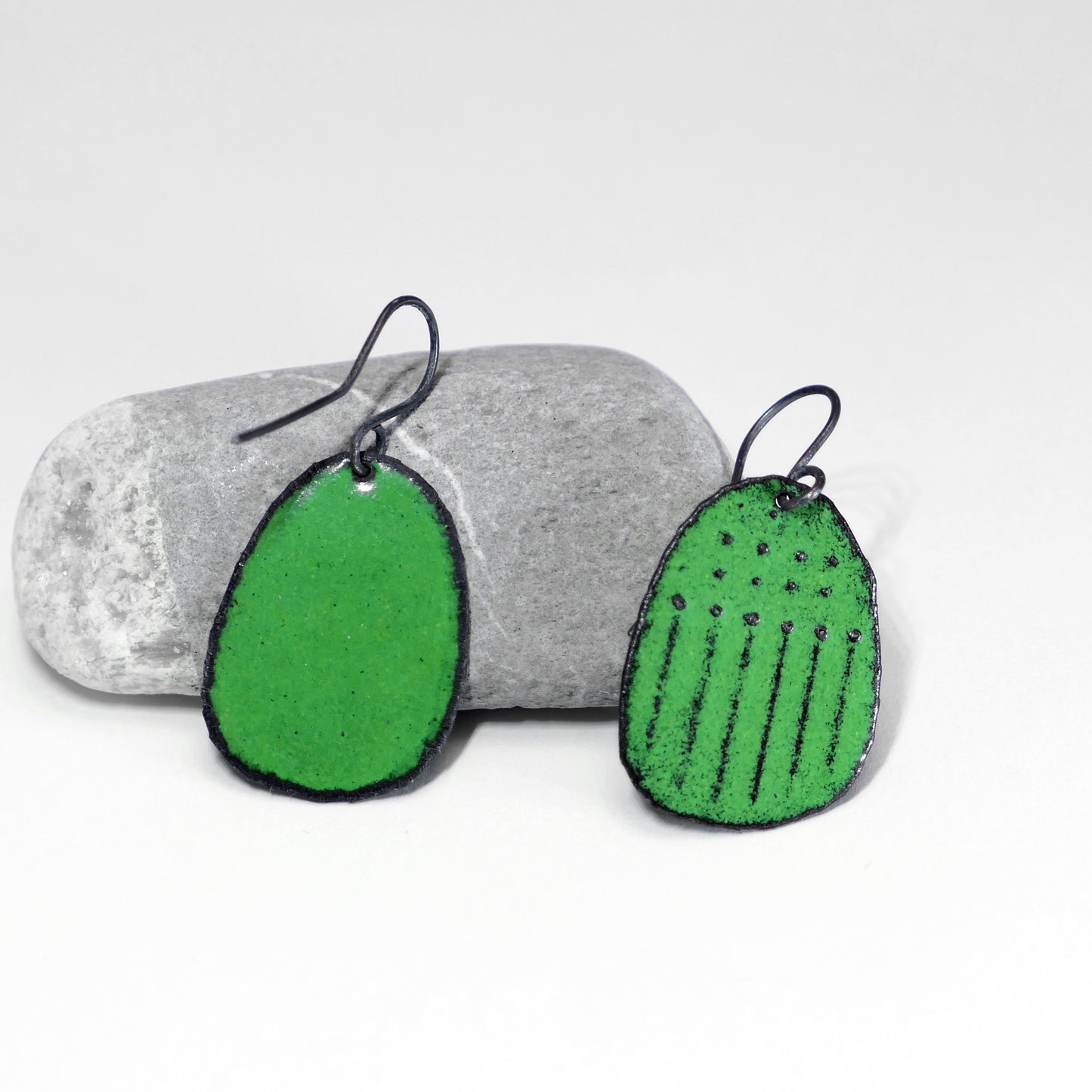 Green earrings, dots and lines