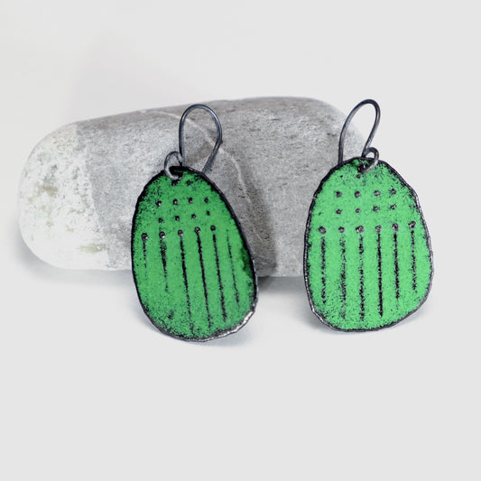 Green earrings, dots and lines