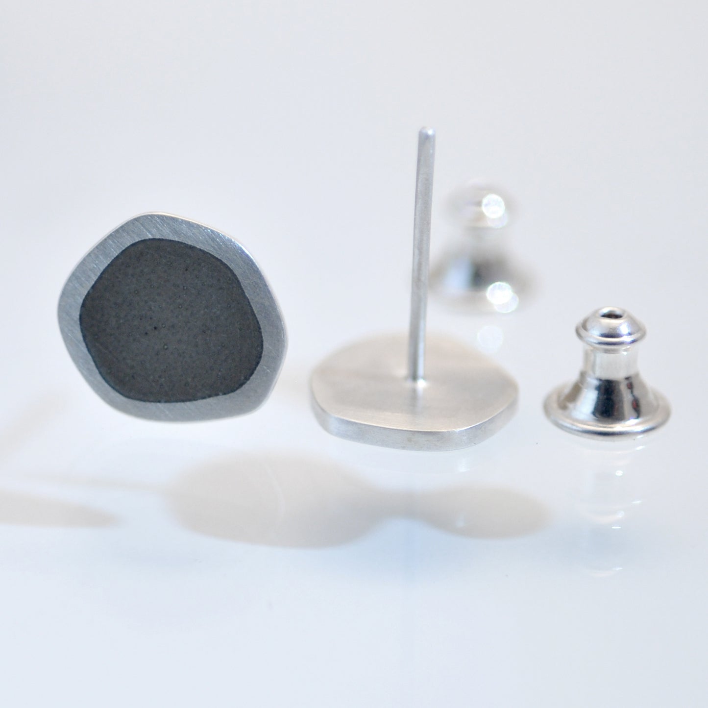 ‘Flat-boulder’ ear-stud, silver and earth-grey vitreous enamel