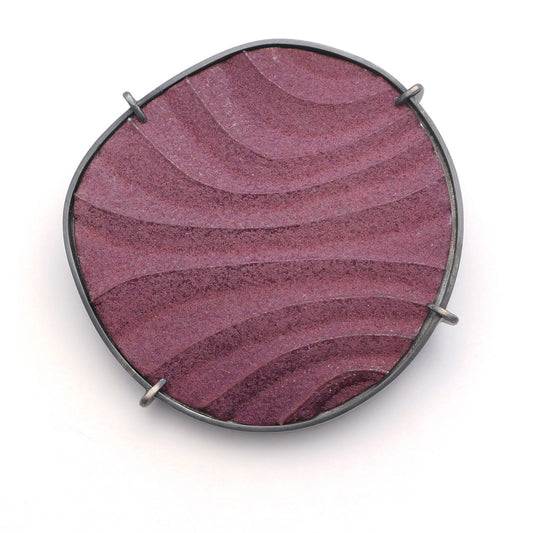 Brooch, finely textured enamelled surface in contoured lines,purple colour with