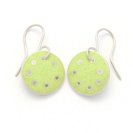 Small round earrings with lime-green enamel in silver with pierced dots on perimeter