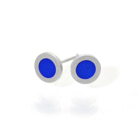Small flat round ear studs with Mid blue coloured enamel in the centre