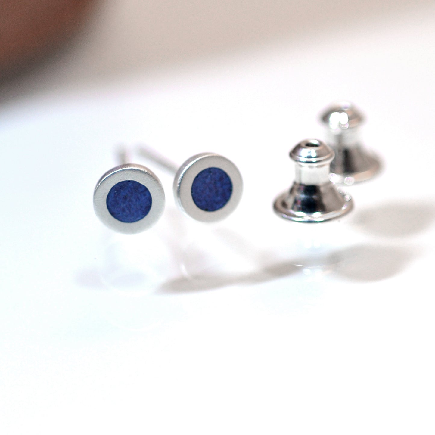 Tiny round sterling silver ear studs with Pale Violet Blue vitreous enamel