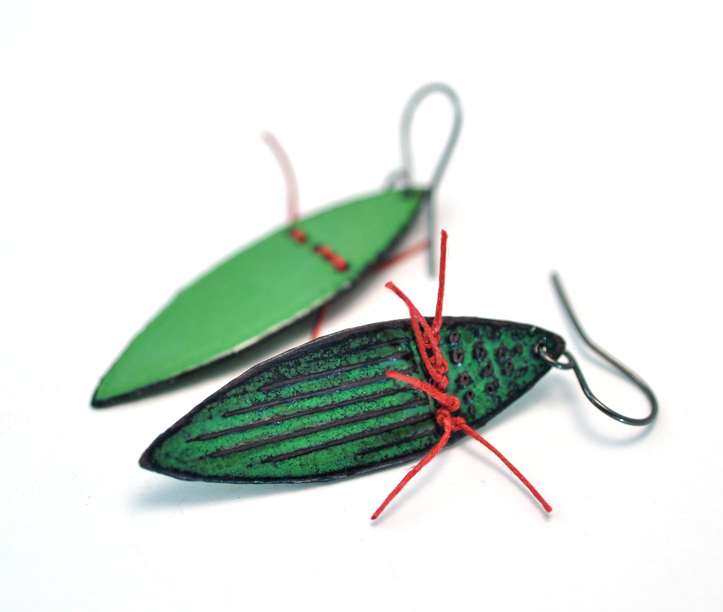 Earrings, green vitreous enamel with red linen thread