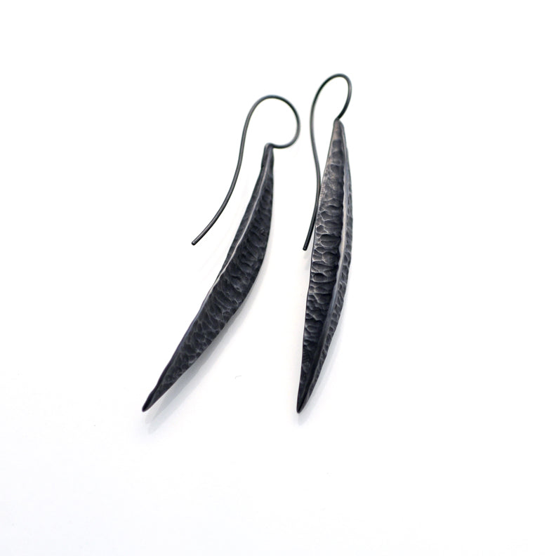 Long solid silver earrings . The silver is oxidised, it is a charcoal black. They are elegant