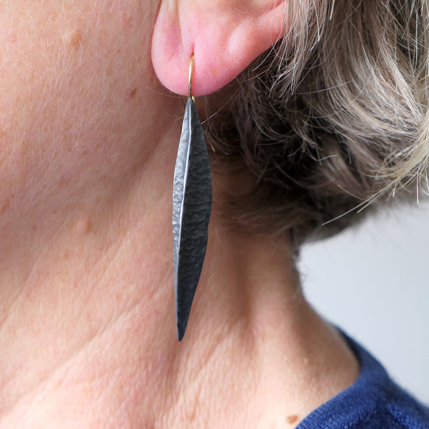 Long oxidised textured seed pod earrings with 18ct yellow gold earwires