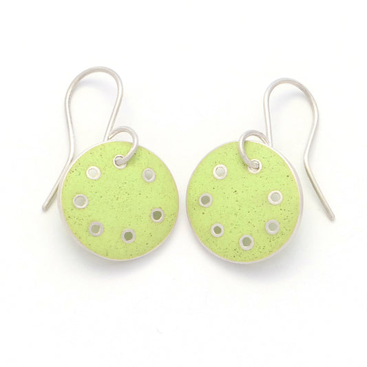 Small round earrings with lime-green enamel in silver with pierced dots on perimeter 