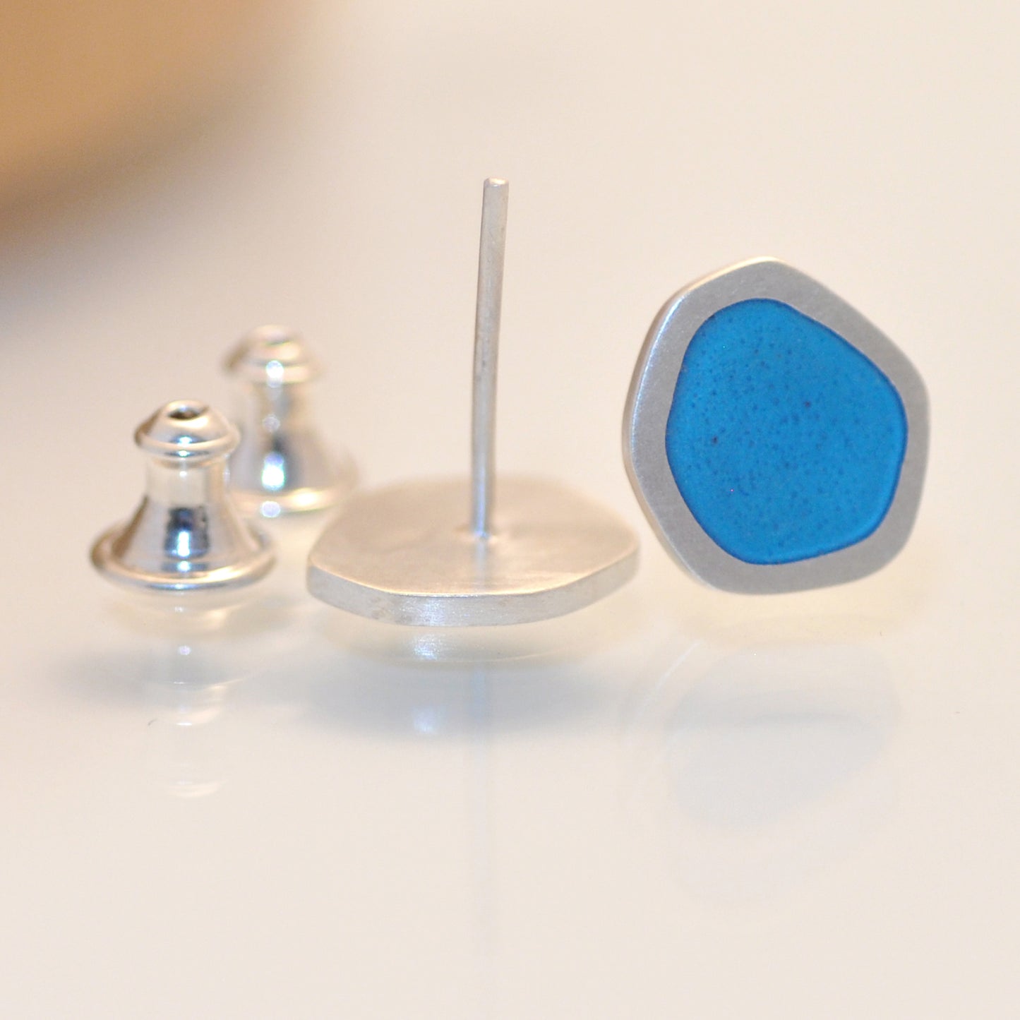 ‘Flat-boulder’ ear-stud, silver and blue turquoise vitreous enamel