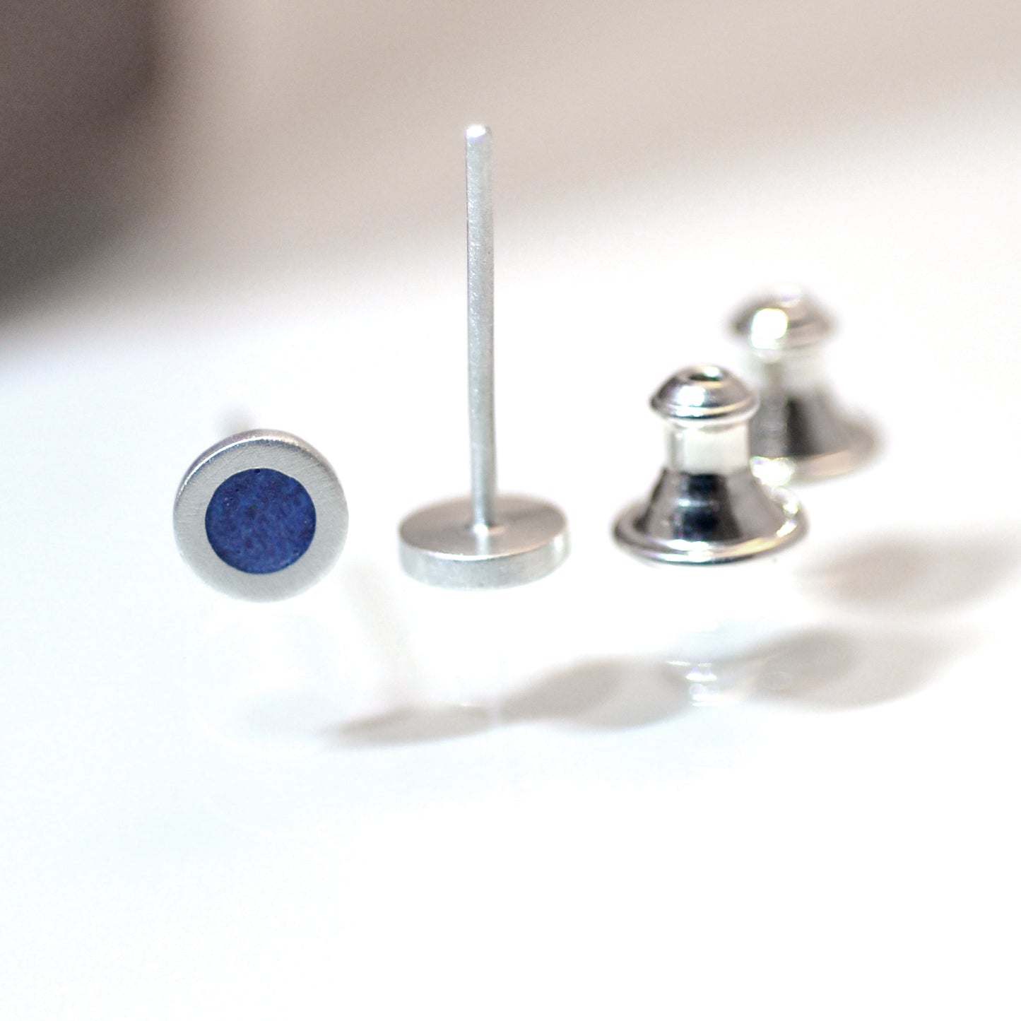 Tiny round sterling silver ear studs with Pale Violet Blue vitreous enamel