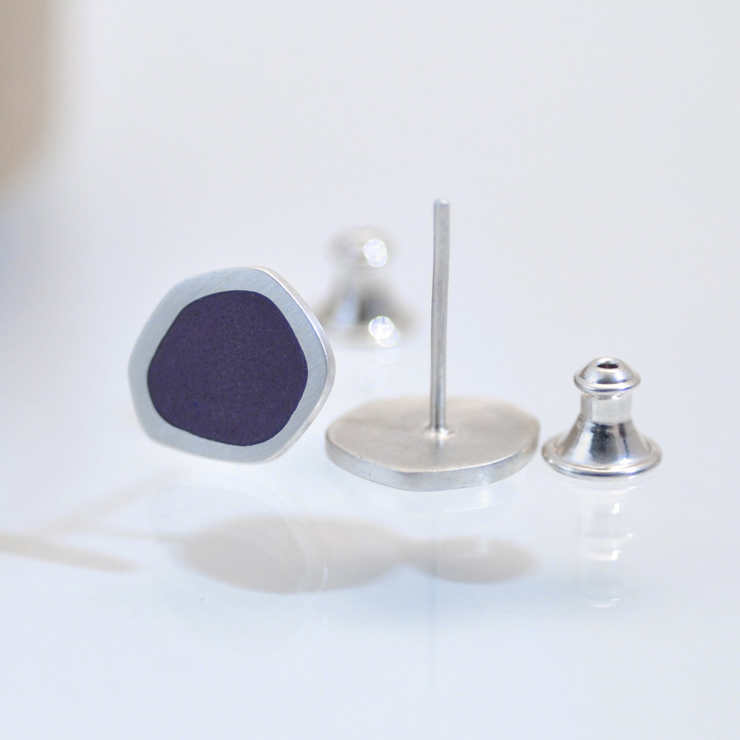 ‘Flat-boulder’ ear-stud, silver and purple vitreous enamel